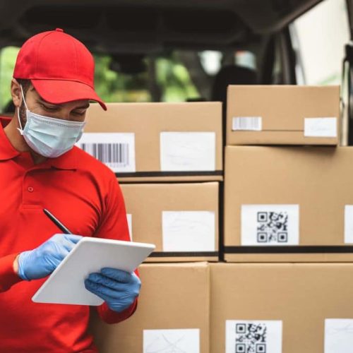 delivery-man-wearing-face-protective-mask-to-avoid-4BHQQCR-1024x683